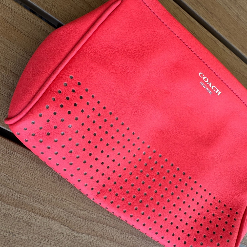 Coach Pink Perforated Leather Wristlet Clutch